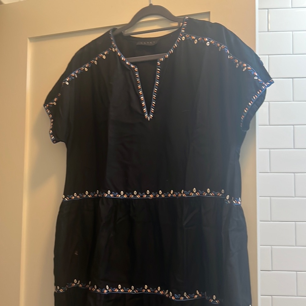 Hatch knee length dress. Black with blue, pink and white stitching.